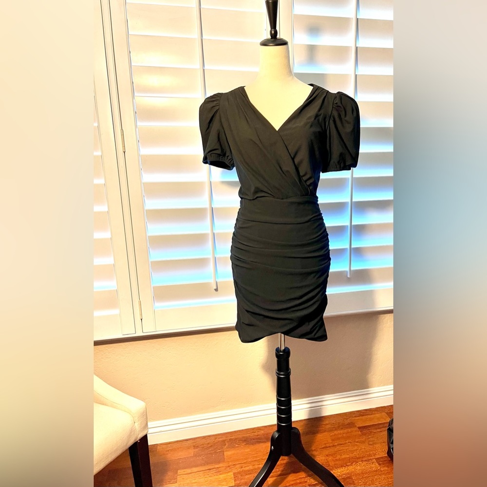 Black. Size small Express dress. Flattering ruching.